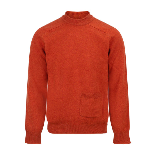 Orange wool sweater with a pocket on a white background